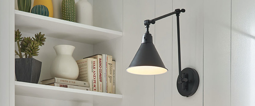 Wall lighting fixture by Capitol Lighting installed next to a bookshelf.